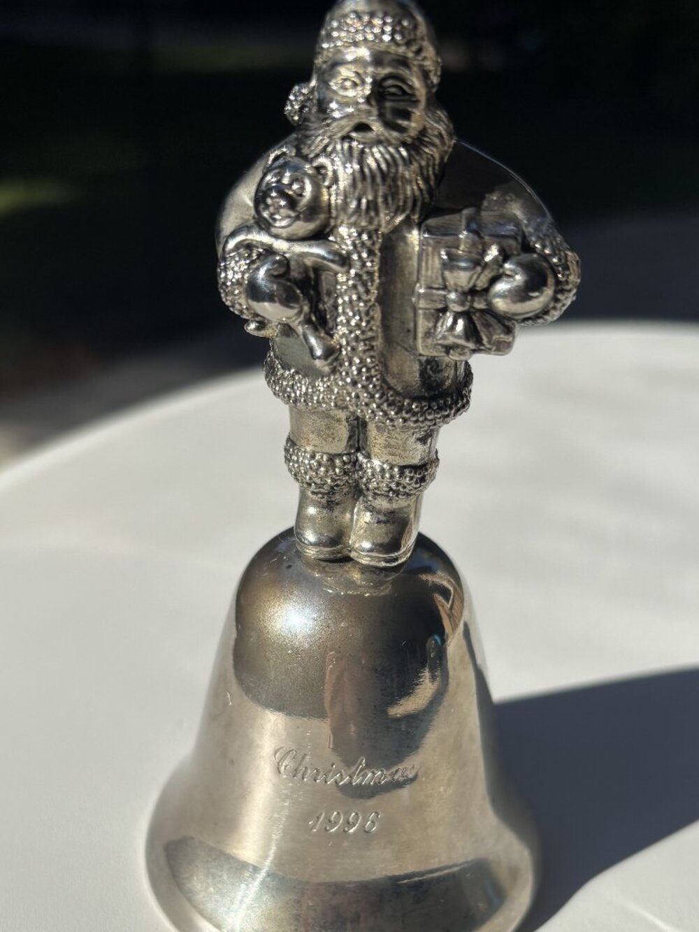 Vintage Madison Avenue silver-plated Santa Claus holiday bell from 1996